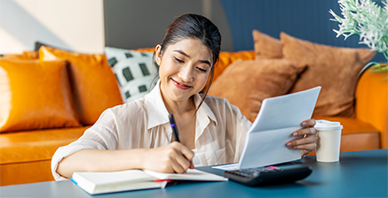 Woman balancing a checkbook