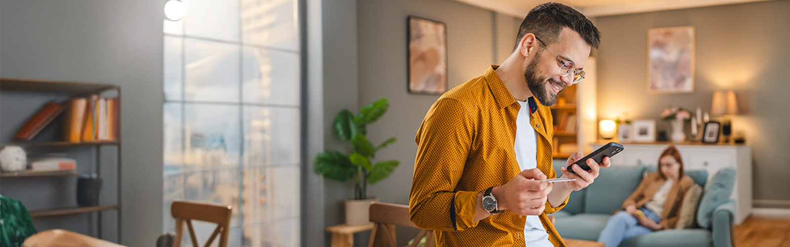 Man making payments on his phone