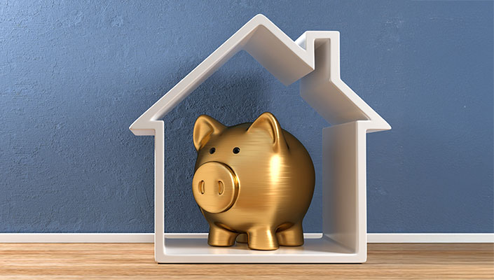 Golden piggy bank in a house