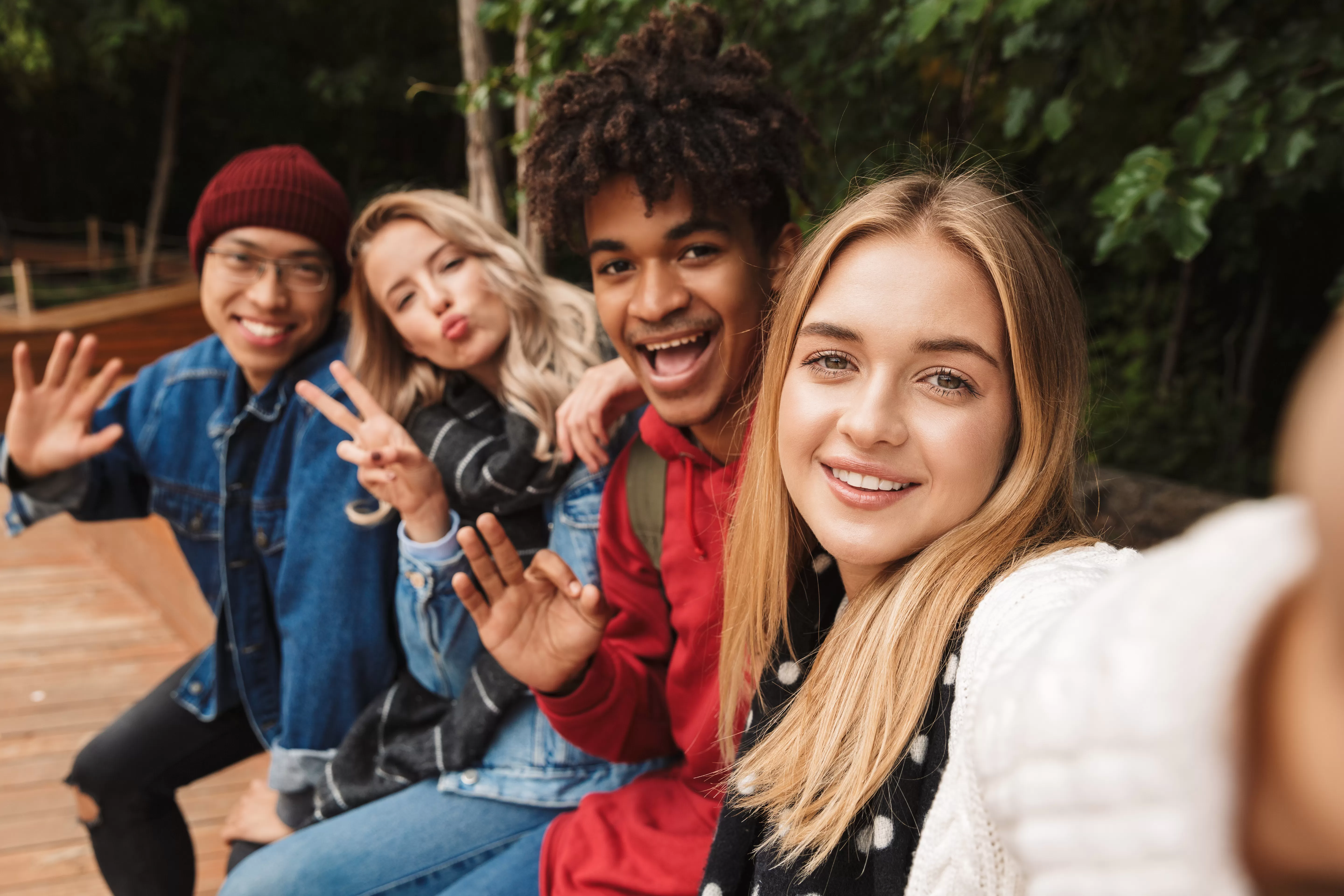 Teens taking a group selfie