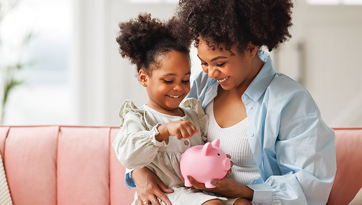 Mom and daughter saving money